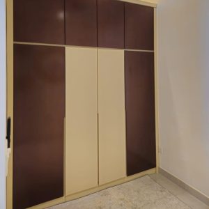 Two Tone Bedroom Closet with Overhead Storage